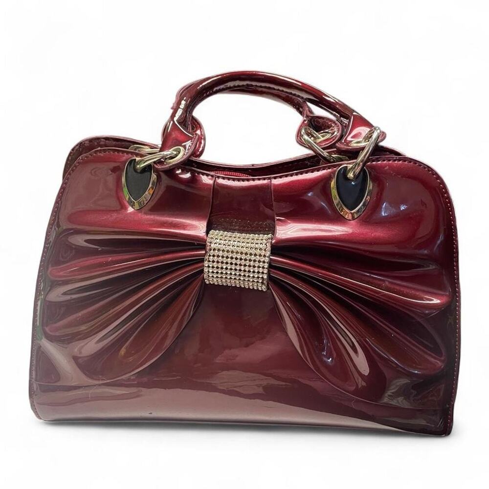 Burgundy patent leather bow handbag